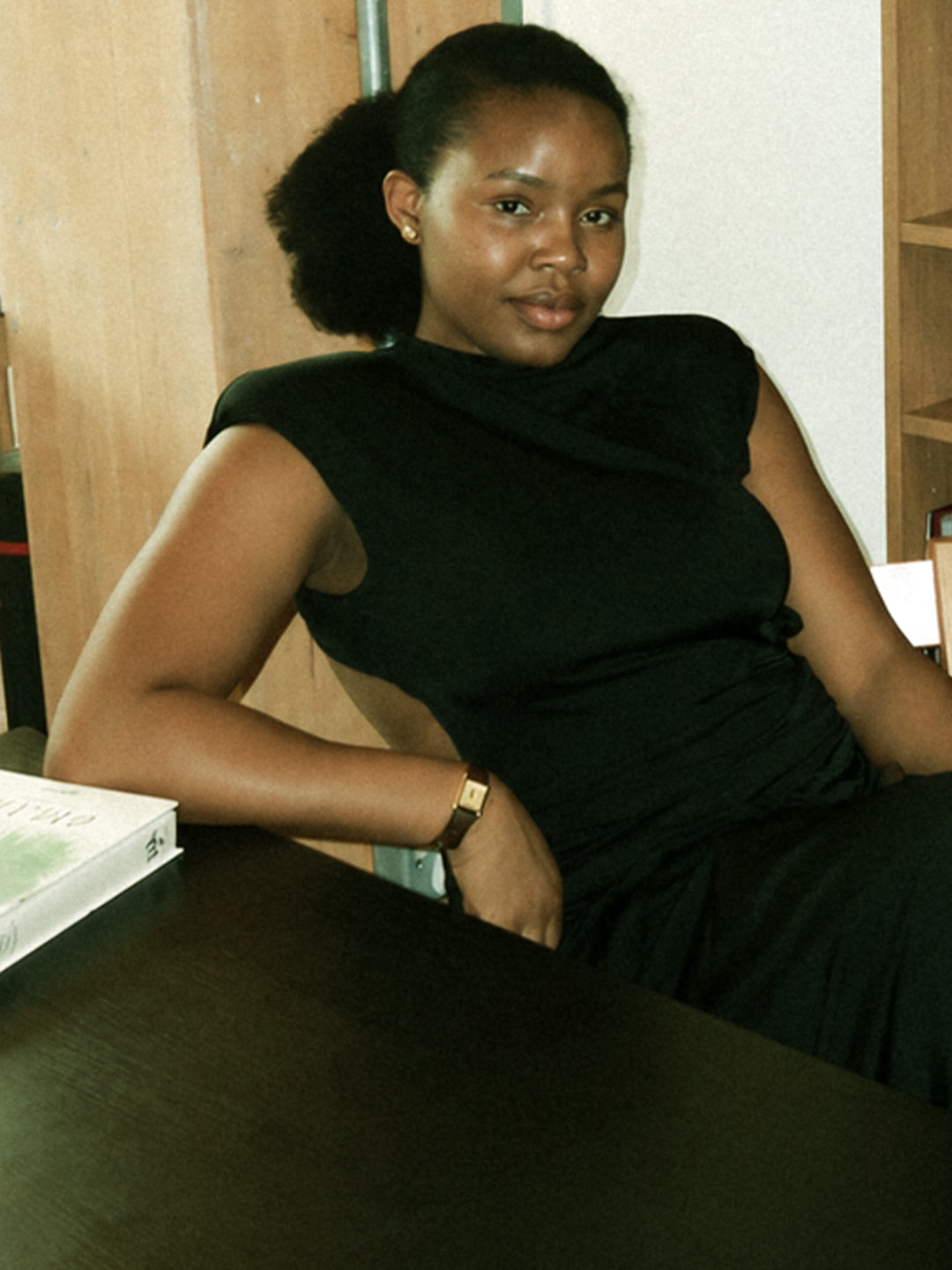 Bunmi Agusto seated in her studio wearing SÉLONE