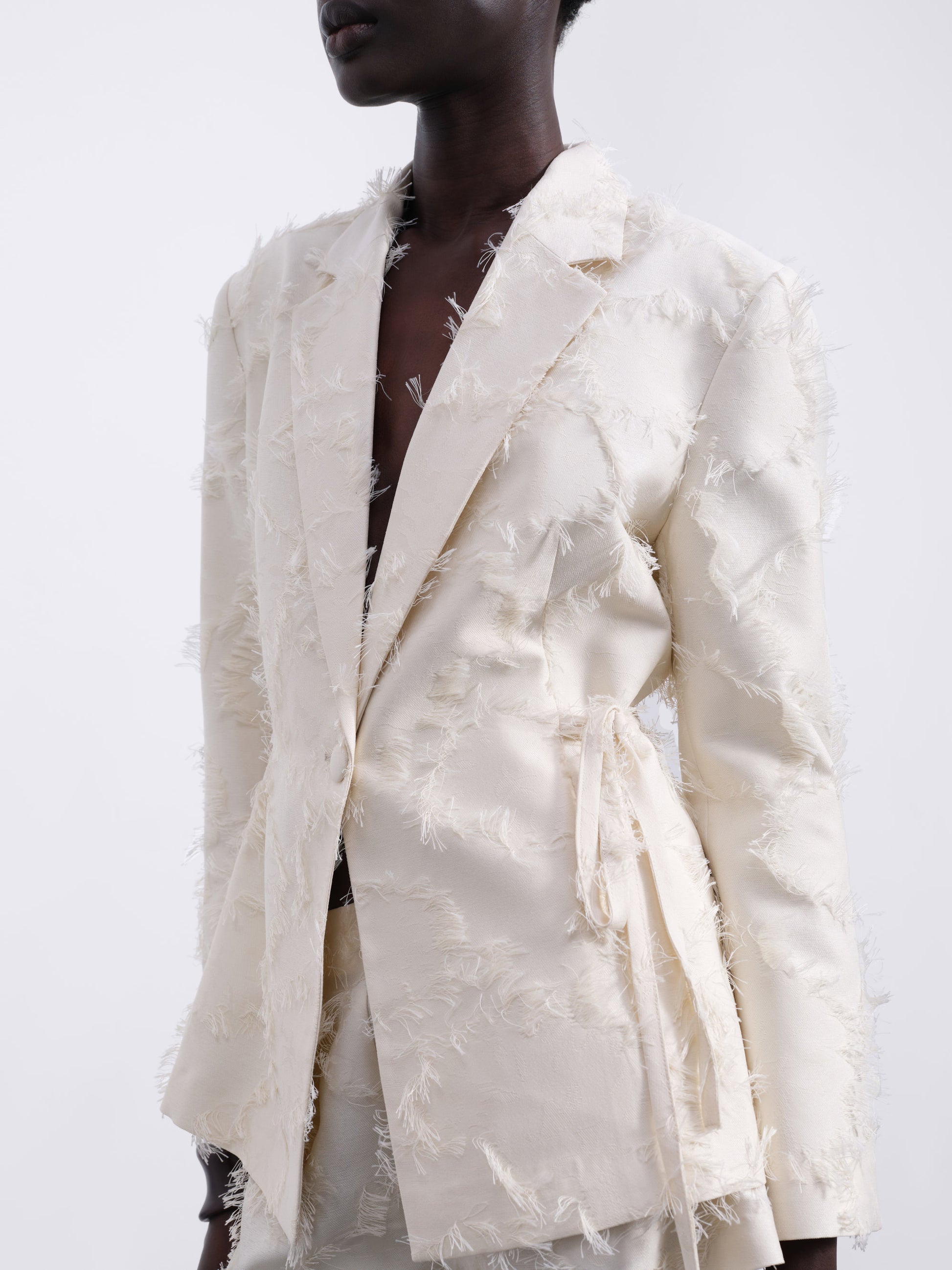 Jora Fringe Textured Open-Back Blazer — Cream