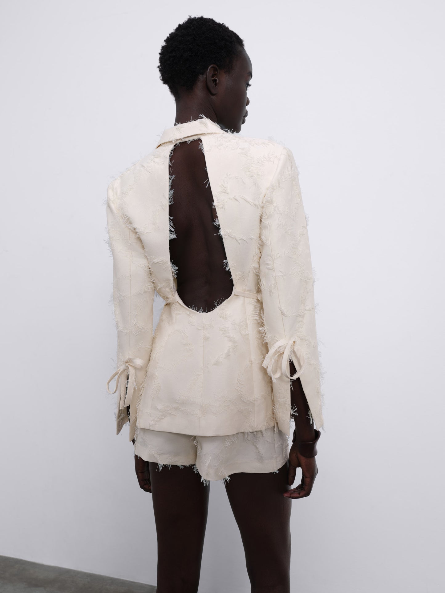 Jora Fringe Textured Open-Back Blazer — Cream