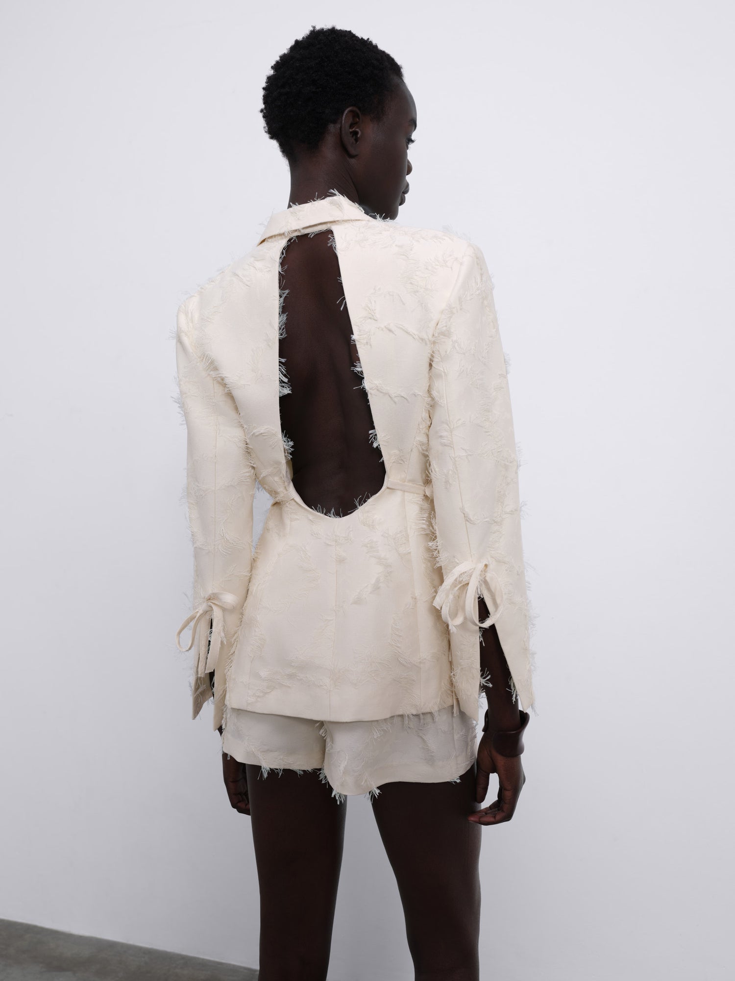 Jora Fringe Textured Open-Back Blazer — Cream